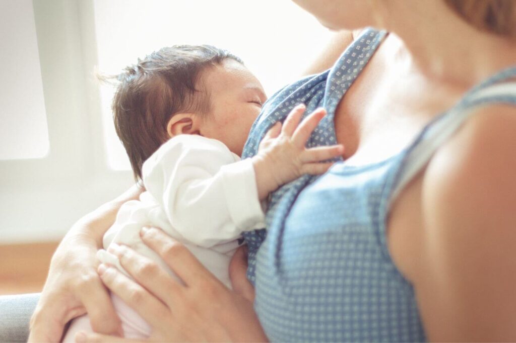 A woman breastfeeding her baby