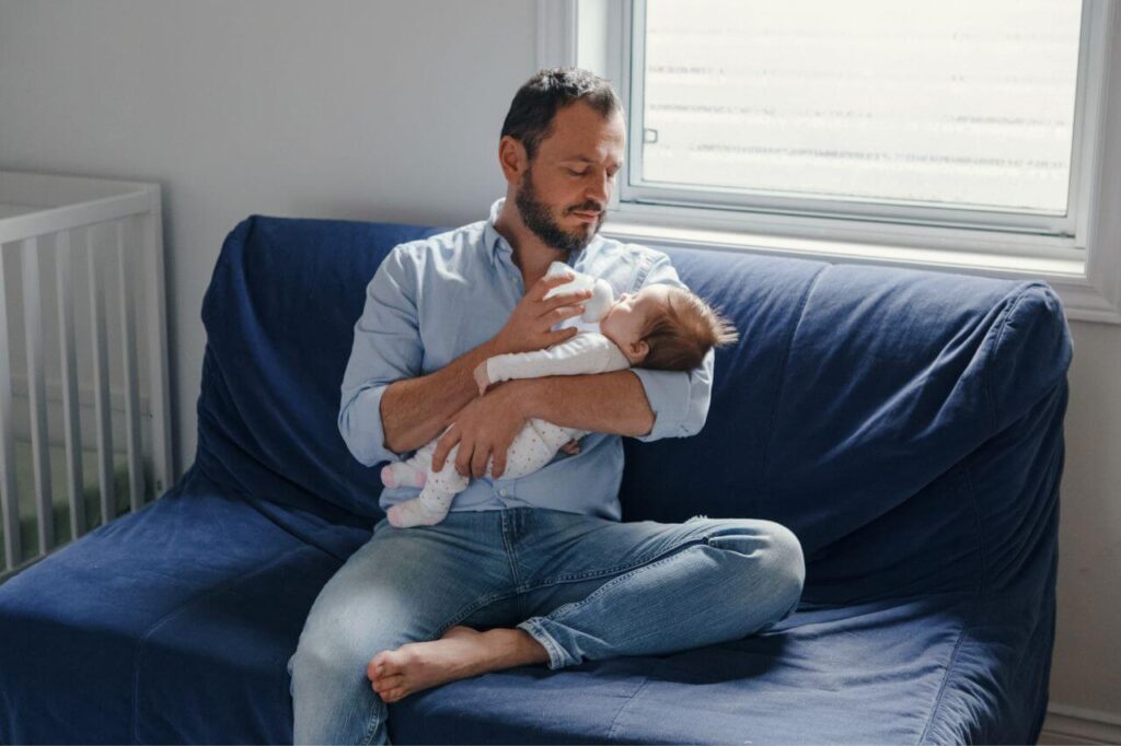 Combination Feeding: The Solution for Every Busy Mom 5 Father feeding newborn with bottled milk