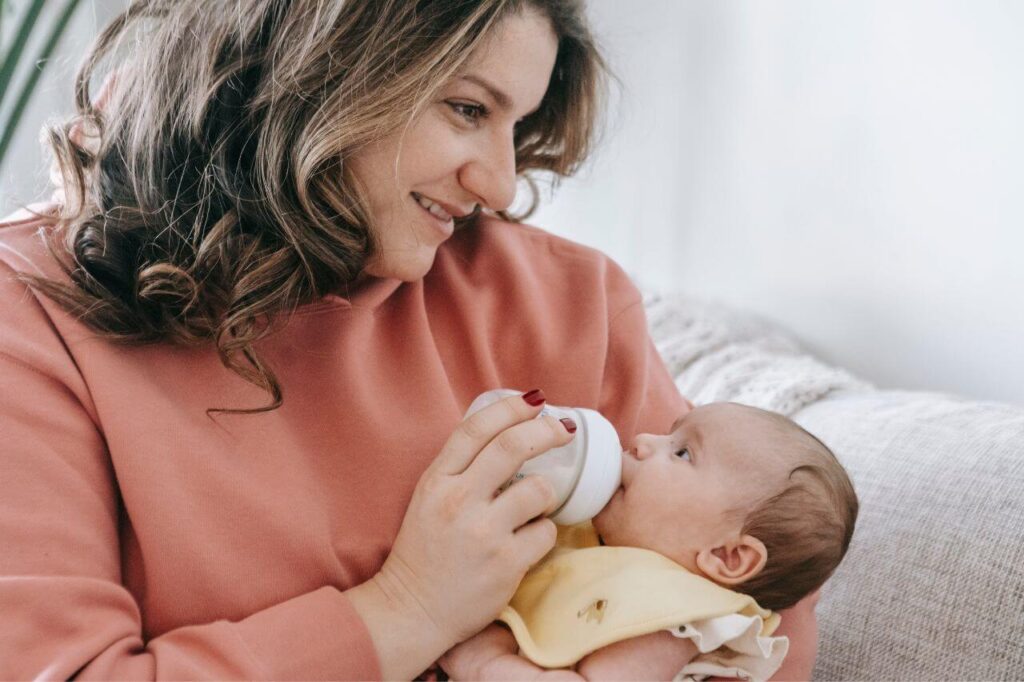 Combination Feeding: The Solution for Every Busy Mom 2 Positive woman feeding newborn baby