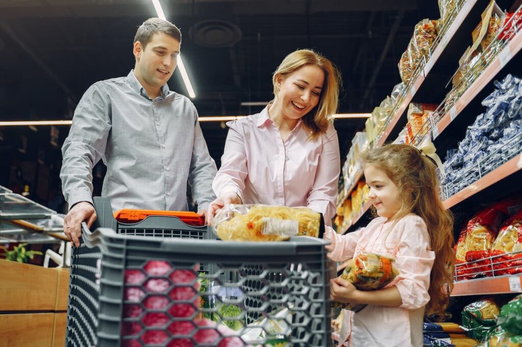 How to Teach Math to Preschoolers 7 Parents shopping with a kids with a cart full of grocery in front of them